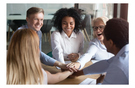 group of coworkers with hands together representing teamwork