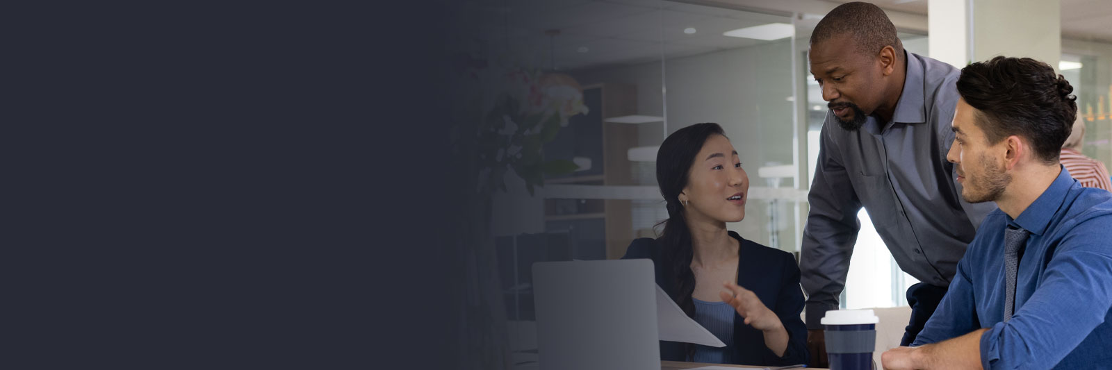 diverse female and male businesspeople working on laptop in office